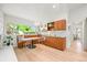 Bright dining area with large windows, built-in bench seating, and updated fixtures at 5200 W Rowland Ave, Littleton, CO 80128