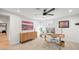 Bright home office featuring a stylish desk, ceiling fan and modern décor for a comfortable and productive workspace at 5200 W Rowland Ave, Littleton, CO 80128