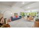 Spacious living room with lots of natural light and hardwood floors at 5200 W Rowland Ave, Littleton, CO 80128