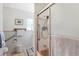 Bright bathroom features tiled walls, shower and bath, grab bars, and updated fixtures at 6040 Taft Ct, Arvada, CO 80004