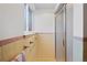 Clean bathroom with a shower and window providing light at 6040 Taft Ct, Arvada, CO 80004