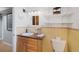 Clean bathroom vanity with good lighting, shelving, and storage at 6040 Taft Ct, Arvada, CO 80004