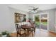 Bright dining area with hardwood floors and sliding glass doors leading to a fenced backyard at 6040 Taft Ct, Arvada, CO 80004