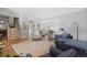 Cozy living room with hardwood floors, staircase, and plantation shutters for natural light at 6040 Taft Ct, Arvada, CO 80004