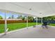 Covered patio providing a comfortable outdoor living space overlooking the backyard at 6040 Taft Ct, Arvada, CO 80004
