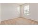 Bright bedroom with two windows and neutral carpet providing a calming atmosphere at 14065 Harrison St, Thornton, CO 80602