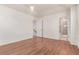 Bright bedroom with wood floors and attached bathroom featuring standing shower at 14065 Harrison St, Thornton, CO 80602