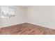 Bedroom offers wood floors and bright natural light from large window at 14065 Harrison St, Thornton, CO 80602