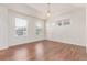 Bedroom with wood flooring and large windows providing plenty of natural light at 14065 Harrison St, Thornton, CO 80602