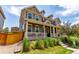 Attractive two-story home with a welcoming front porch and well-maintained lawn and garden at 14065 Harrison St, Thornton, CO 80602
