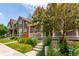 Street view showcasing a row of well-kept homes, each with a front porch and landscaped front yard at 14065 Harrison St, Thornton, CO 80602