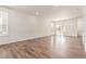 Spacious living room with wood flooring, and natural light creating a welcoming atmosphere at 14065 Harrison St, Thornton, CO 80602