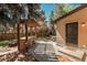 Backyard featuring a custom BBQ grill and pergola, seating area, and mature trees at 5000 S Chester St, Greenwood Village, CO 80111