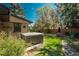 Private backyard featuring a hot tub, patio, and manicured landscaping for relaxing outdoor living at 5000 S Chester St, Greenwood Village, CO 80111