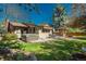 Spacious backyard with a hot tub and outdoor dining area, providing a great space for relaxation and entertaining at 5000 S Chester St, Greenwood Village, CO 80111