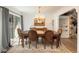 Elegant dining room featuring a chandelier, dining table with seating, and natural light at 5000 S Chester St, Greenwood Village, CO 80111