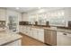 The kitchen features granite countertops, stainless steel appliances, and lots of natural light at 5000 S Chester St, Greenwood Village, CO 80111