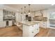 Spacious kitchen features a large center island, stainless steel appliances, and ample counter space at 5000 S Chester St, Greenwood Village, CO 80111