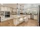 Spacious kitchen features a large center island, stainless steel appliances, and ample counter space at 5000 S Chester St, Greenwood Village, CO 80111