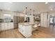 Open kitchen with a large island, modern appliances, and a bright, inviting atmosphere at 5000 S Chester St, Greenwood Village, CO 80111