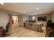 Spacious living room with wood flooring, ample seating, and a neutral color palette at 5000 S Chester St, Greenwood Village, CO 80111