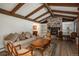Cozy living room featuring a stone fireplace, hardwood floors, and comfortable seating at 5000 S Chester St, Greenwood Village, CO 80111