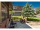 Cozy patio featuring a charming brick fire pit and comfortable seating for outdoor relaxation and entertaining at 5000 S Chester St, Greenwood Village, CO 80111