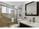 Clean bathroom with updated vanity, shower, and decorative accents at 9647 Pelon Dr, Northglenn, CO 80260