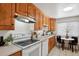 Bright kitchen features ample cabinetry and modern appliances at 9647 Pelon Dr, Northglenn, CO 80260