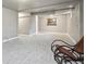 Basement features neutral carpet, a rocking chair and neutral walls at 55 Emerald St, Broomfield, CO 80020