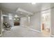 Basement features neutral carpet, two rocking chairs, a piano, and a bathroom at 55 Emerald St, Broomfield, CO 80020