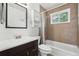 Cozy bathroom with tiled shower and bath, modern sink and mirror at 55 Emerald St, Broomfield, CO 80020