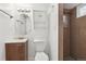 Bathroom featuring neutral tiling in the shower, vanity and fixtures at 55 Emerald St, Broomfield, CO 80020
