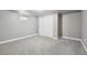 This bedroom has gray carpet, gray walls, a closet, and a window for soft natural light at 55 Emerald St, Broomfield, CO 80020