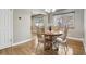 Dining room with hardwood floors and a round wooden table with seating for four at 55 Emerald St, Broomfield, CO 80020