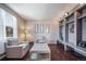 Inviting entryway featuring custom built-in storage, seating, and hardwood flooring at 12035 Fontberry St, Parker, CO 80134