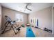 Functional exercise room equipped with fitness equipment, natural light, and a ceiling fan at 12035 Fontberry St, Parker, CO 80134