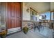 Inviting front porch with a cozy seating area, stone accents, and a welcoming front door at 12035 Fontberry St, Parker, CO 80134
