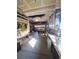 Spacious garage featuring ample storage, a yellow truck, and well-organized tool and equipment areas at 12035 Fontberry St, Parker, CO 80134