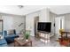 Bright and open living space with stairs, a dining area, and modern decor at 2565 Pierce St, Lakewood, CO 80214