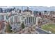 An aerial view of the building with cityscape in the background and ample parking available at 601 W 11Th Ave # 1109, Denver, CO 80204