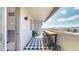 An inviting balcony space features a long bar table with seating, offering an urban view and a cozy outdoor setting at 601 W 11Th Ave # 1109, Denver, CO 80204
