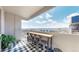 A balcony with a bistro-style bar setup offers city views, perfect for outdoor enjoyment and entertaining at 601 W 11Th Ave # 1109, Denver, CO 80204