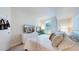 A cozy bedroom featuring plush bedding and a contemporary entertainment setup under soft lighting at 601 W 11Th Ave # 1109, Denver, CO 80204