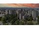 Beautiful condominium building with lush landscaping and mountain views at sunset at 601 W 11Th Ave # 1109, Denver, CO 80204