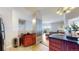Modern kitchen showcasing dark wood cabinets, black countertops, and seamlessly connected living area at 601 W 11Th Ave # 1109, Denver, CO 80204