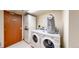 Community laundry room with washer, dryer, and laundry bag at 601 W 11Th Ave # 1109, Denver, CO 80204