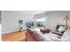 Cozy living room with a comfortable sectional sofa, hardwood floors, and a balcony with a scenic view at 601 W 11Th Ave # 1109, Denver, CO 80204