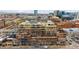 A stunning aerial view of an urban apartment complex showcasing its balconies and surrounding cityscape at 1499 Blake St # 3O, Denver, CO 80202