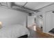 Bright bedroom with an open closet and an exterior view through the doorway at 1499 Blake St # 3O, Denver, CO 80202
